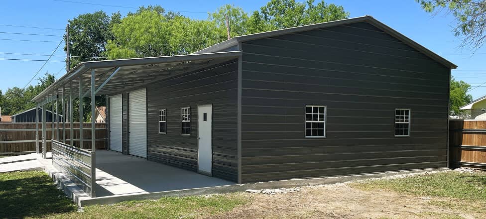 Large Metal Building with Lean-To and side railings and double garage doors