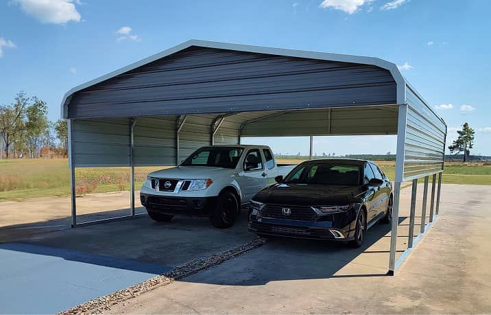 Green regular style roof metal carport covering white RV