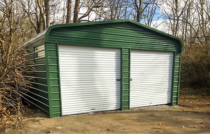 Brown metal garage with regular style roof and walk-in door