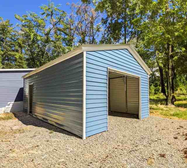 blue metal shed on a gravel foundation