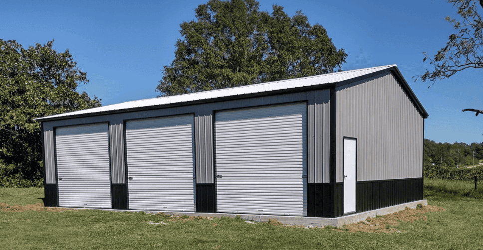 vertical metal building with 3 garage doors on the side and two tone