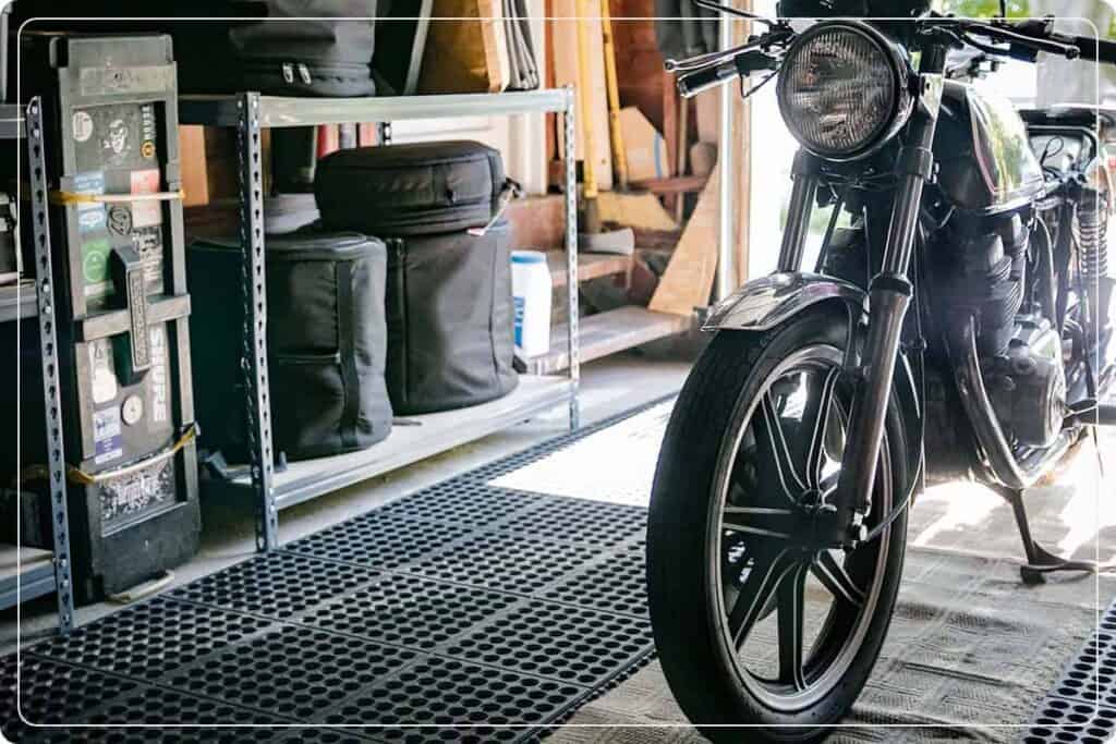 garage floor pad with motorcycle parked on top
