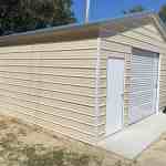 20x20 vertical metal garage with walk in door and window