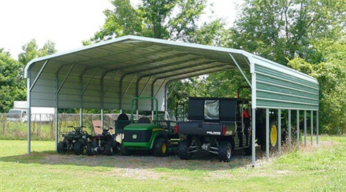 The cost to build a carport like this large, partially enclosed green one will be higher than that for a simple one-car shelter
