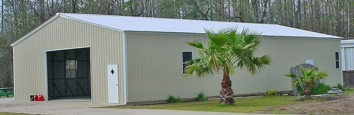 A 50x20 fully enclosed steel carport with one garage door