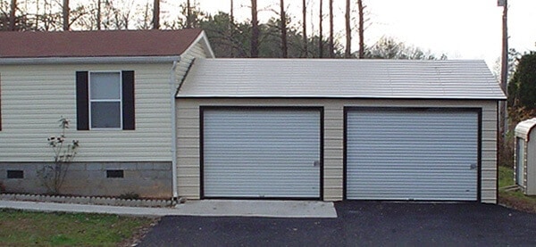 steel-garage-installed-against-home.jpg