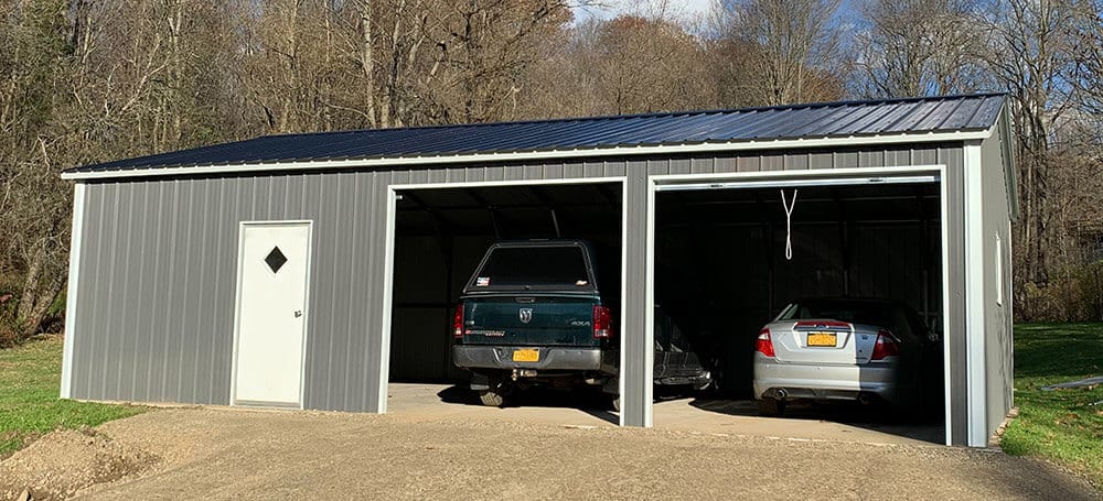 A gray two-car steel garage building