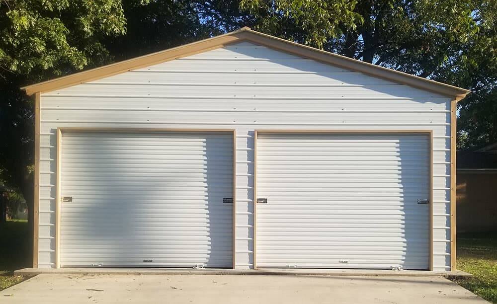 A two-door steel garage building in white with beige trim