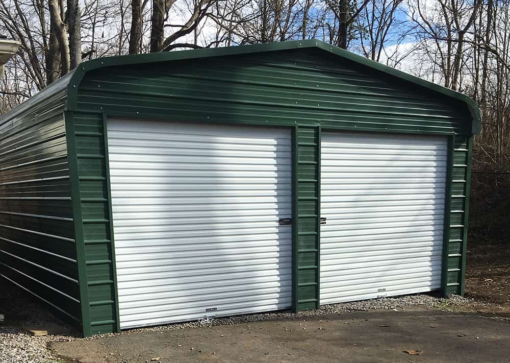 enclosed metal carport with 2 garage doors