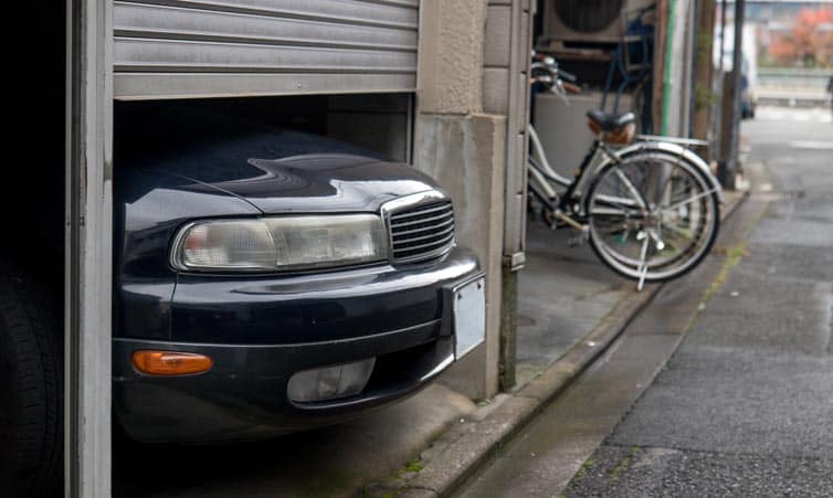 Car sticking out of a garage