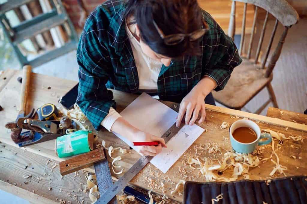 woman working on woodworking project