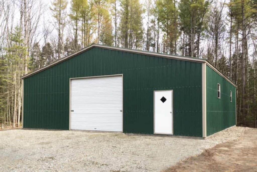 Green 40x40 metal building with garage door