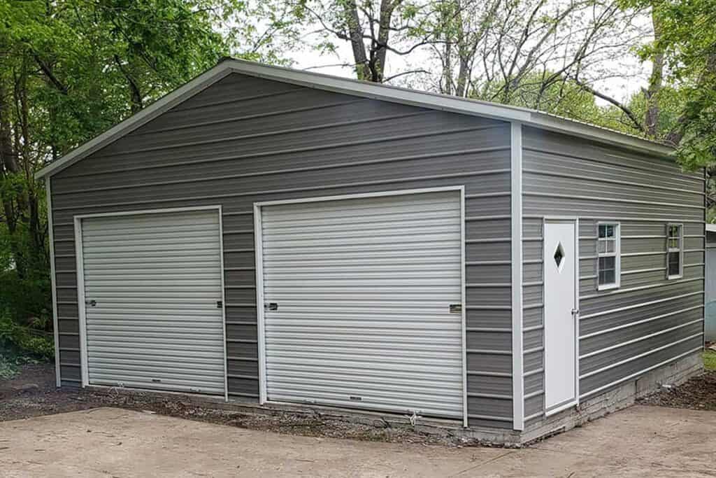 gray metal building with two garage doors
