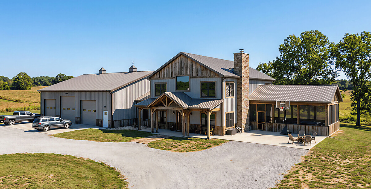 Large barndominium with attached garage bays and a covered porch.
