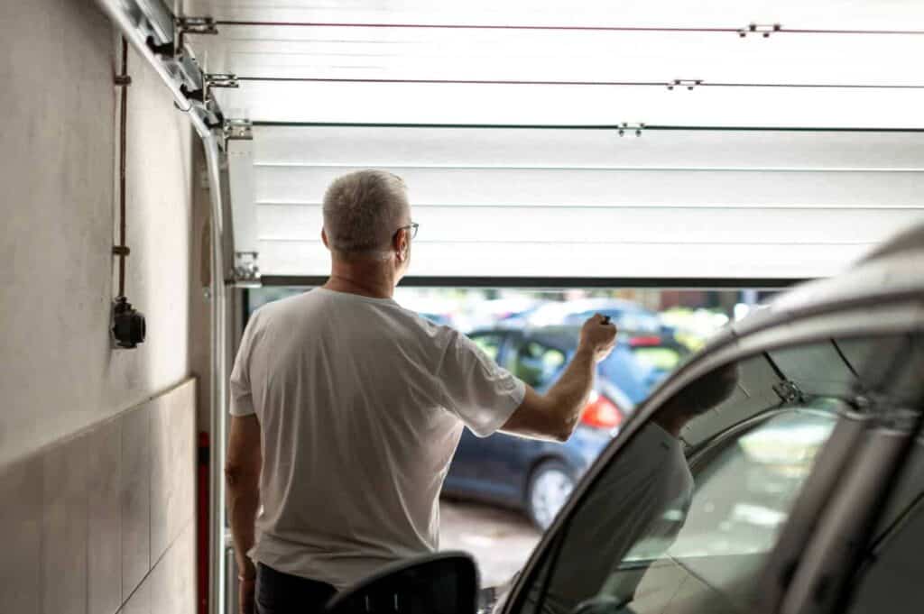 a man opening a garage door