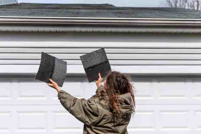 woman choosing roofing material