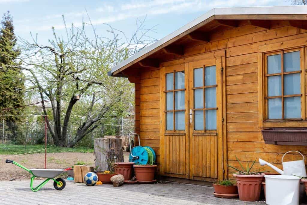 wooden tool shed in a backyard