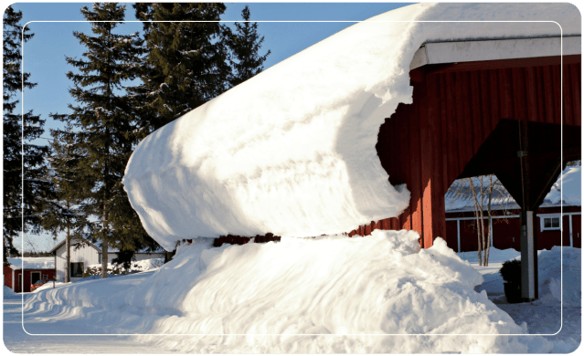 red carport covered in snow