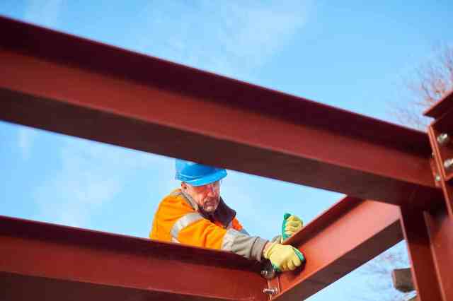 man building metal structure