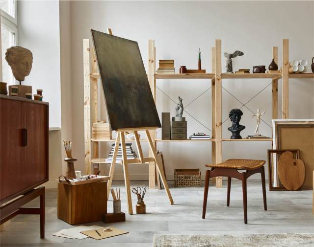 Art studio with wooden easel and sculptures