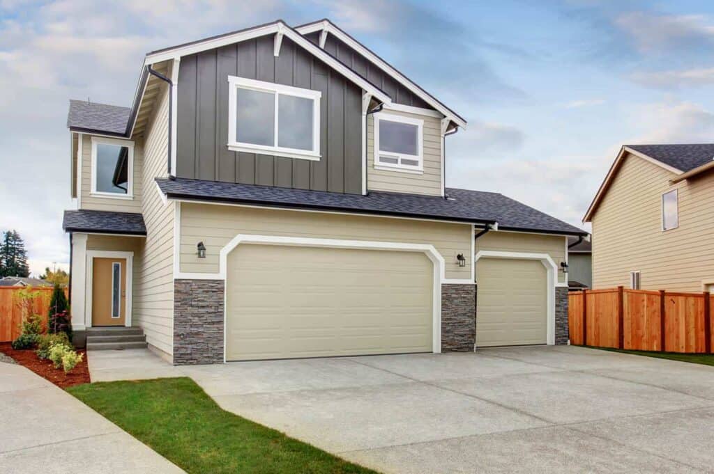 gray and tan house with garage bump-out