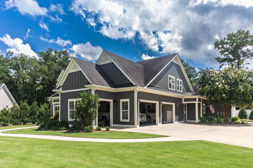 gray garage with a storage room attached