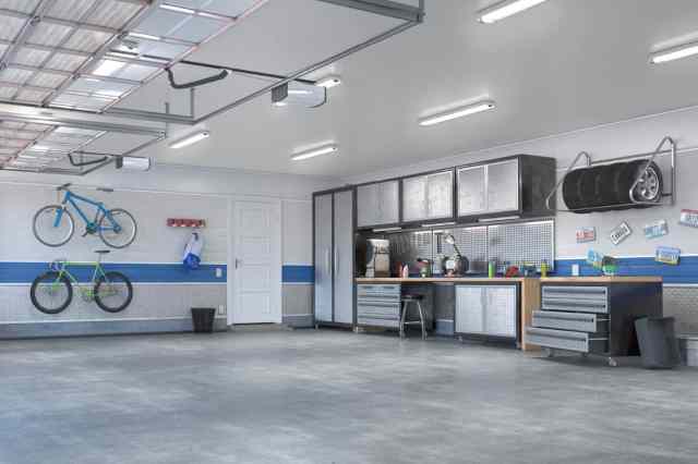 renovated garage with cabinets and racks