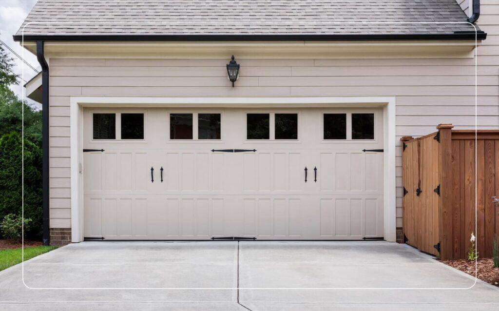 view of a garage adding curb appeal to a home