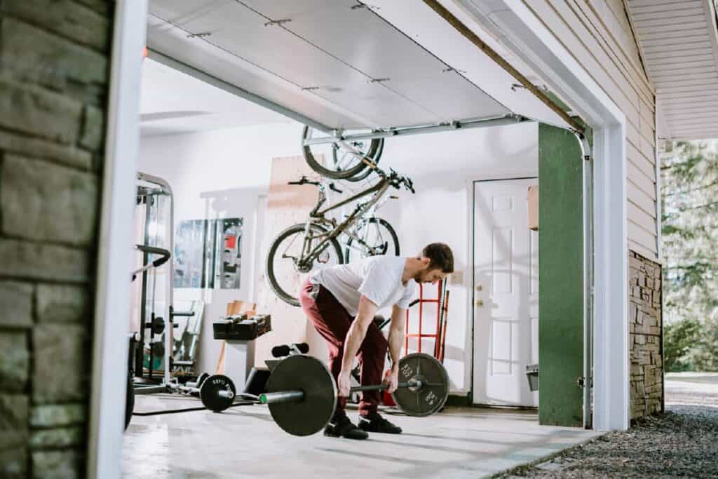 man using garage as a gym