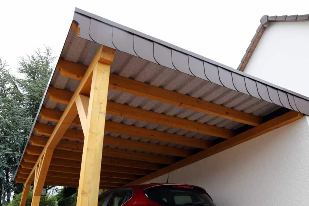 wooden lean-to carport with metal roof