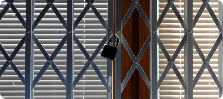 metal security grille locked with padlock