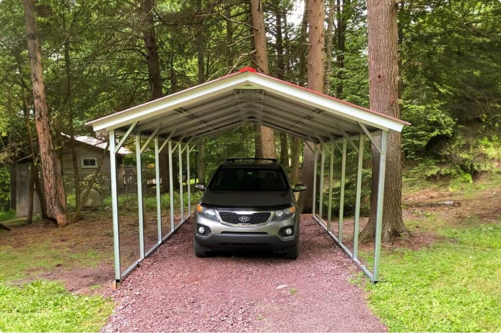 One car carport close to a forest.