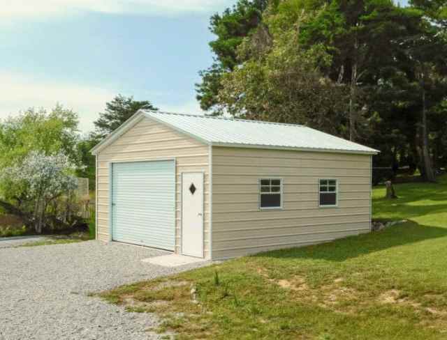 A light beige garage with a garage door and a walk in door.