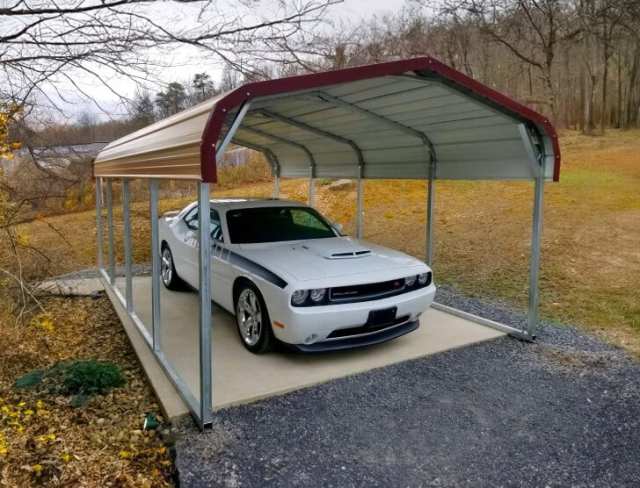 Small one car-carport with an asphalt foundation.