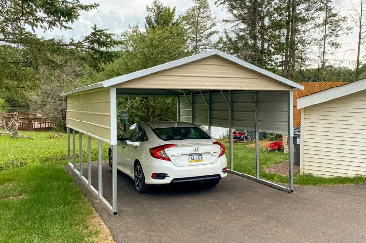 Small carport with side panels.