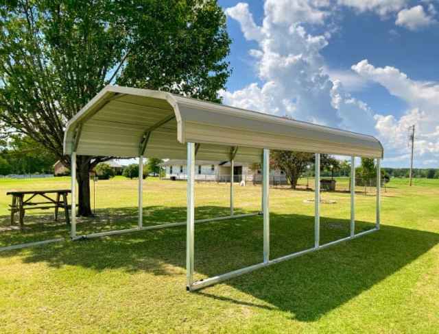 metal carport on a grassy backyard