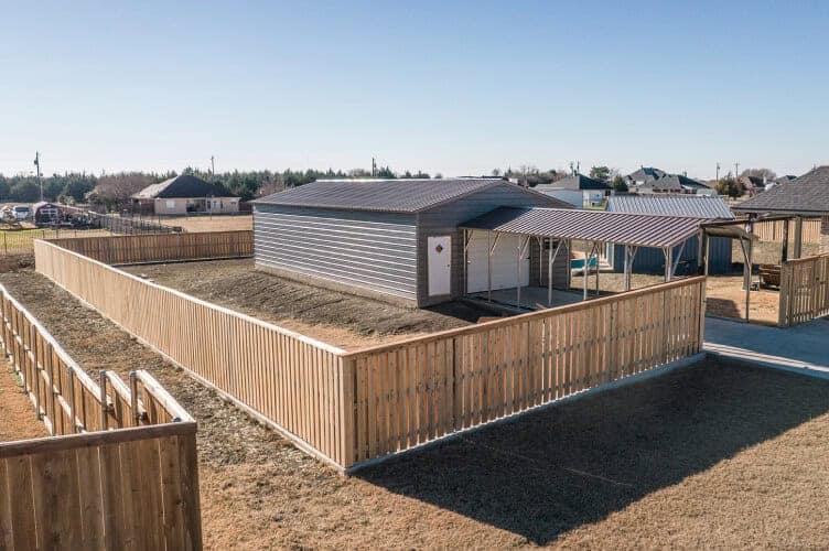 A garage with a wooden fence around it.