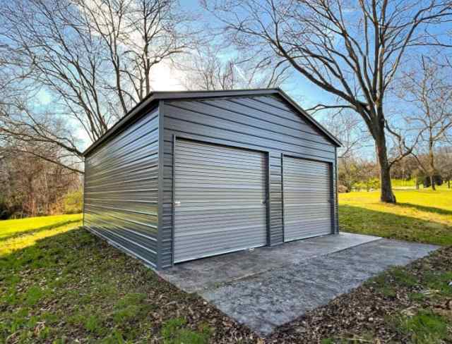 A gray garage with two garage doors.