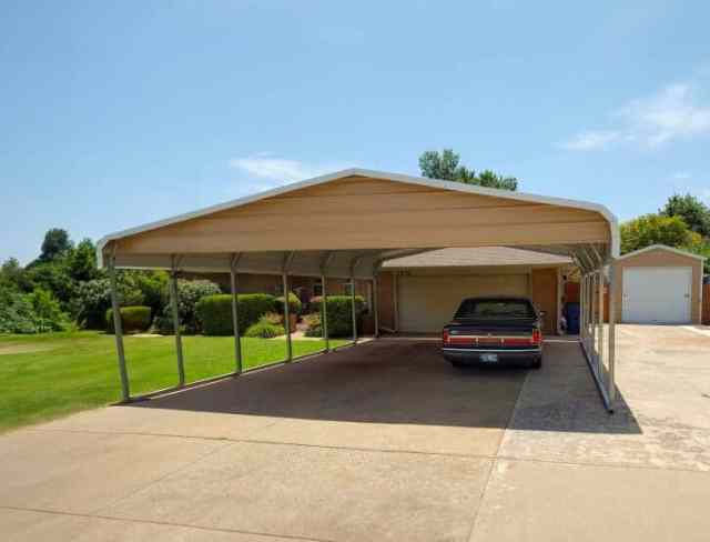 A large carport with side panels and closed gabels.