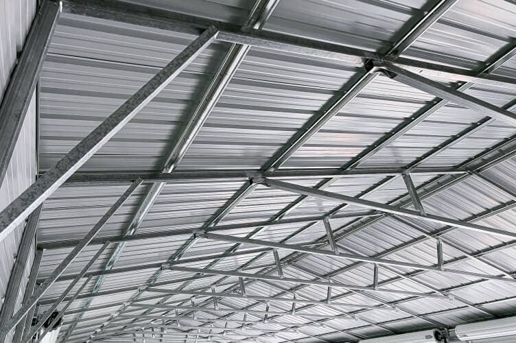 Inside view of a metal garage roof structure.