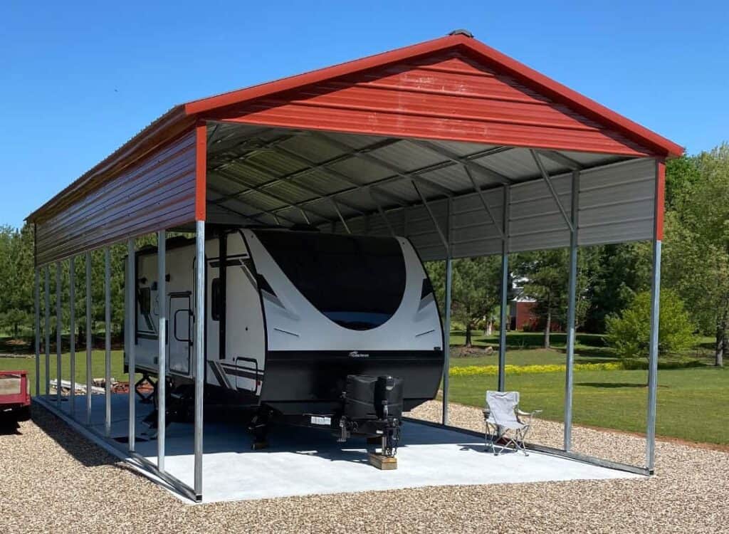 large red metal carport with an RV parked beneath