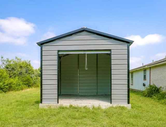 Small garage for storage with an open garage door.