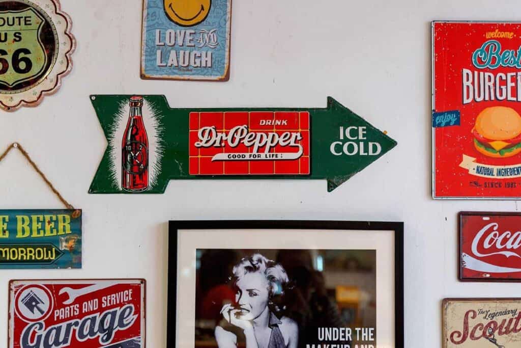 colorful vintage signage hanging on a white white