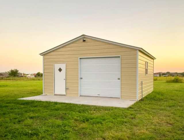 A yellow garage on a grass field