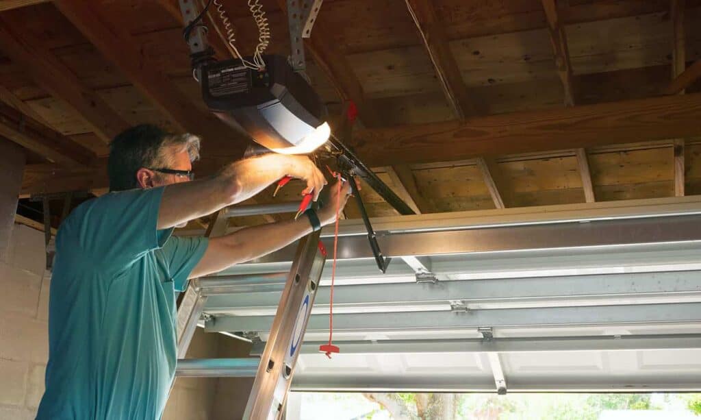 man testing garage door functionality