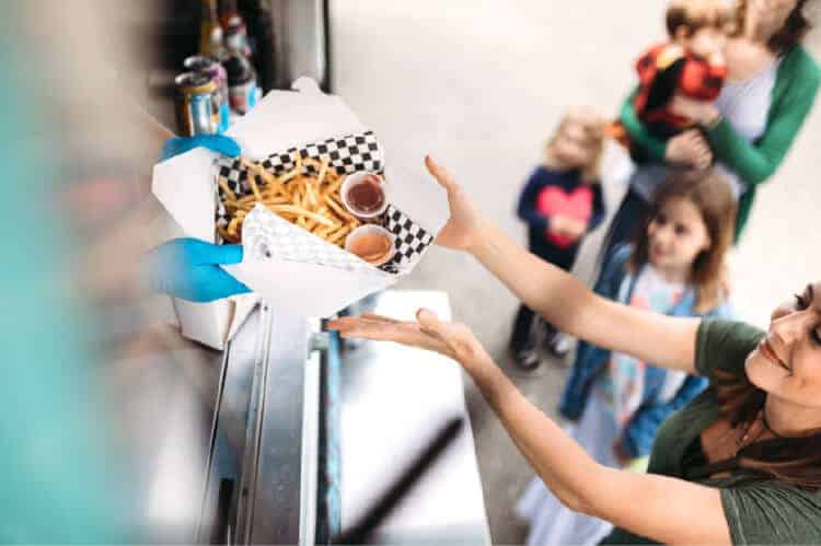 Woman getting food from a concession stand