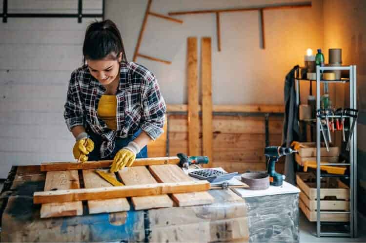 Woman woodworking in a shed