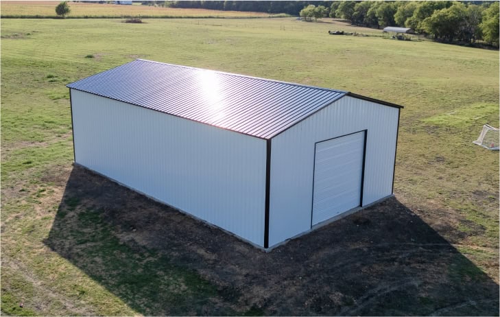 White metal building with black roof