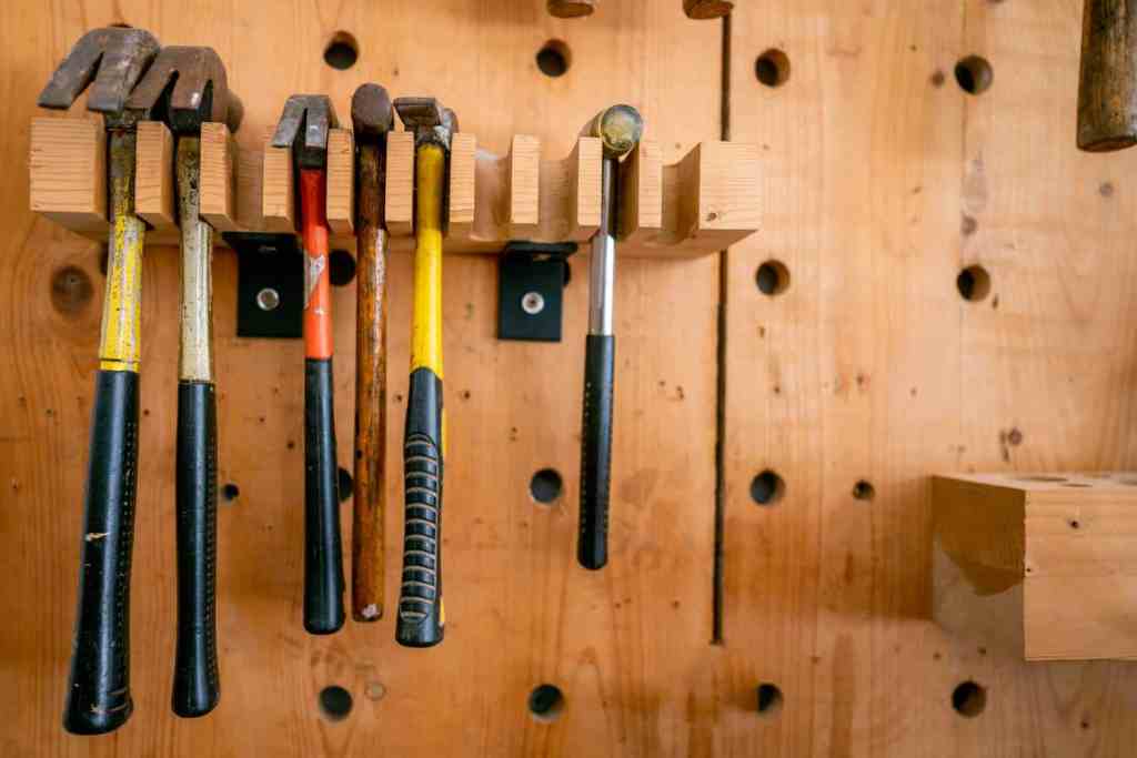 Wooden shelf garage storage idea for hammers and tools. 