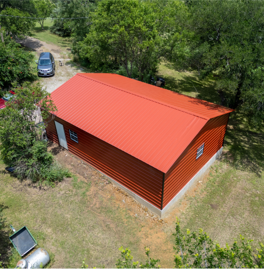 Large red garage with red walls and red roof